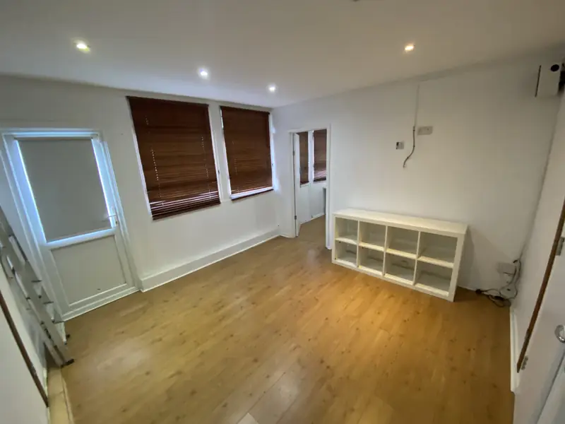 Room with shelving and wood floor